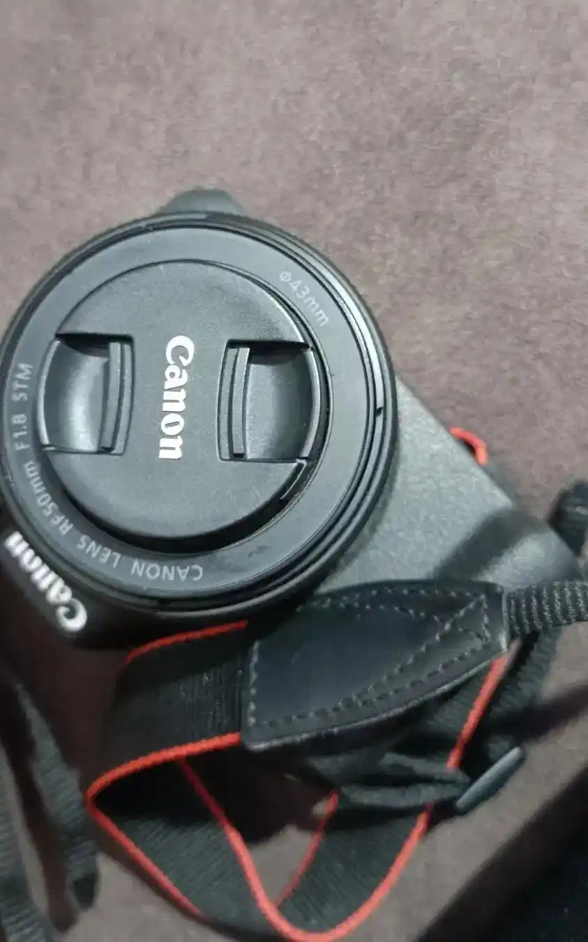 کنون r50 همراه دولنز درحد آکبند دست دو