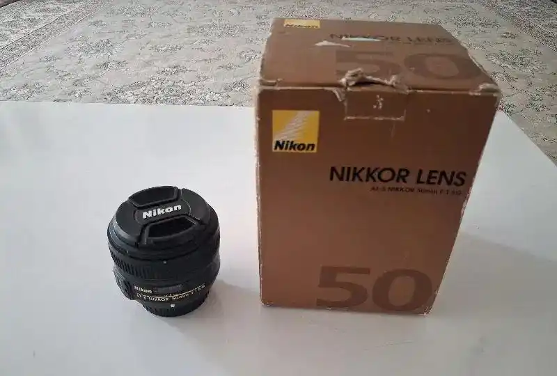 لنز نیکون 50mm f1.8 G دست دو