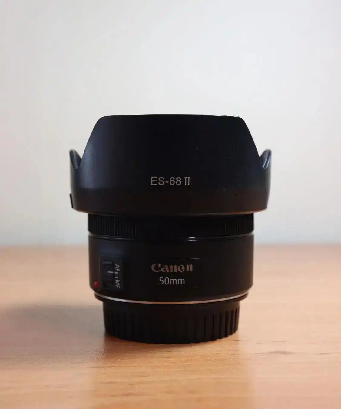 لنز 50mm کنون EF f1.8 STM درحد نو دست دو