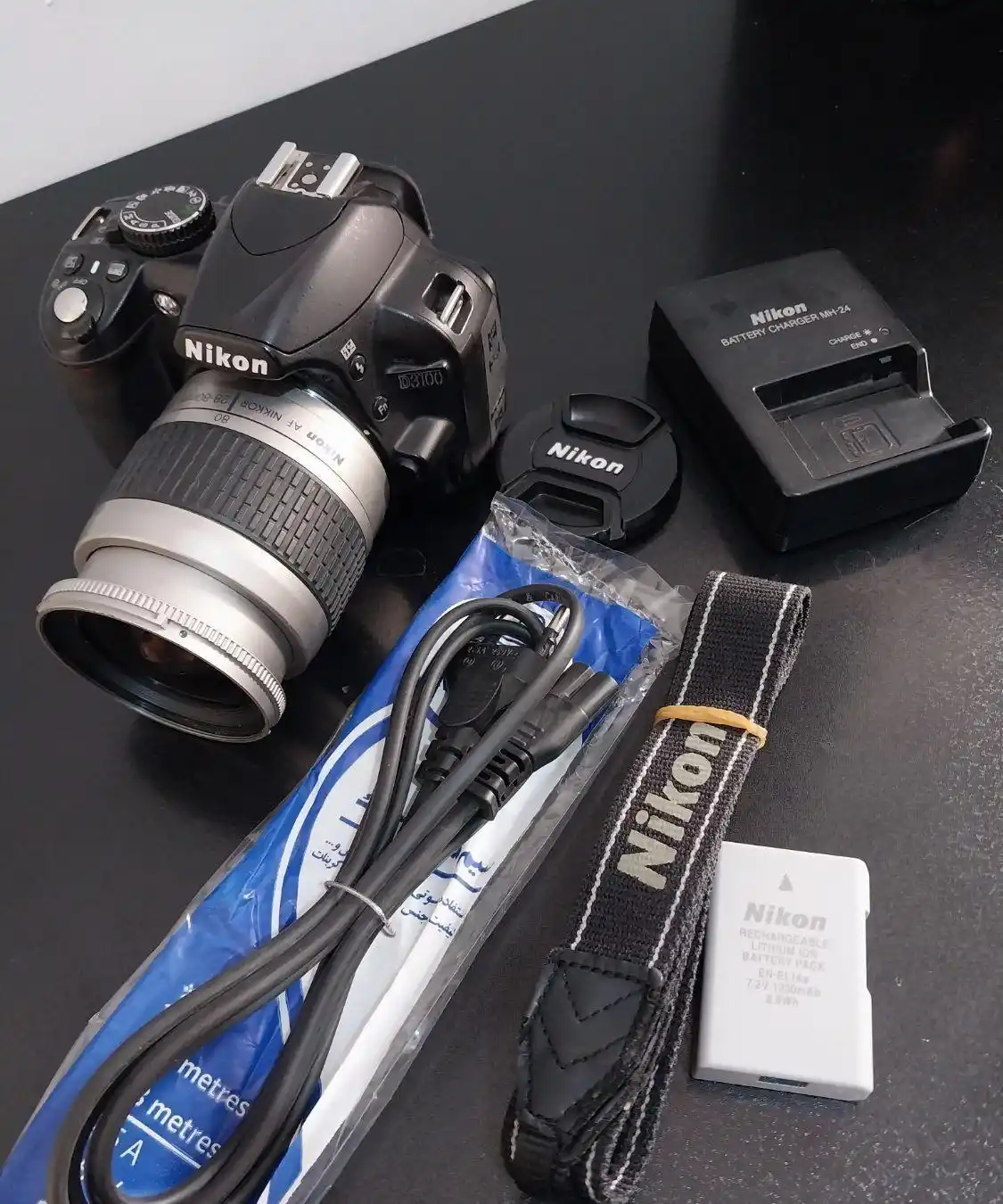 دوربین نیکون 3100d ولنز ۲۸-۸۰ سالم دست دو