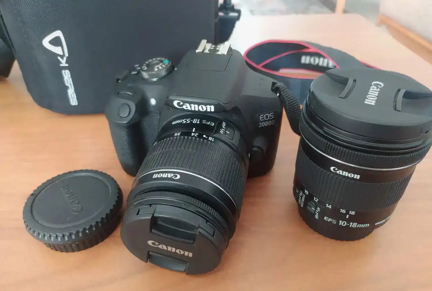 دوربین عکاسی کنون d2000 و لنز واید 10-18 دست دو