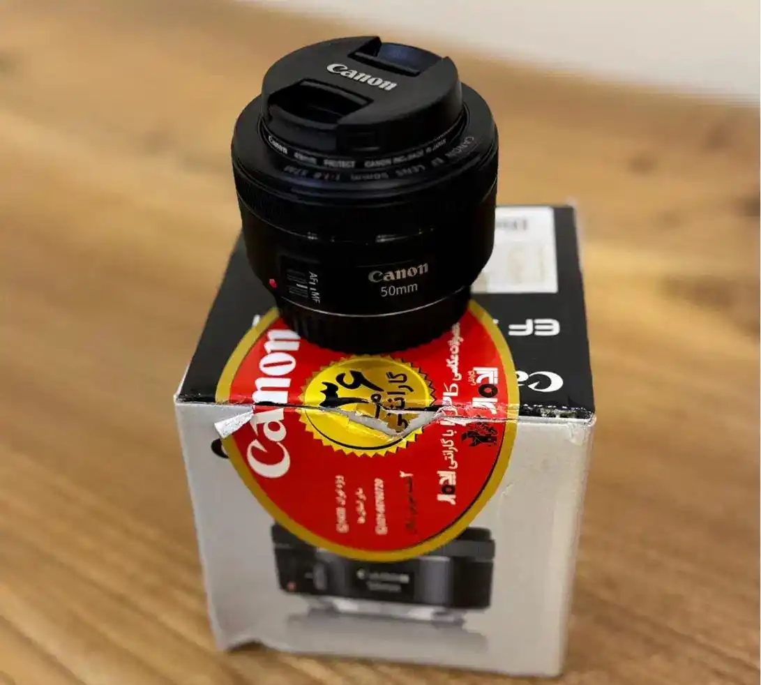لنز دوربین کانن مدل EF 50mm f/1.8 STM دست دو
