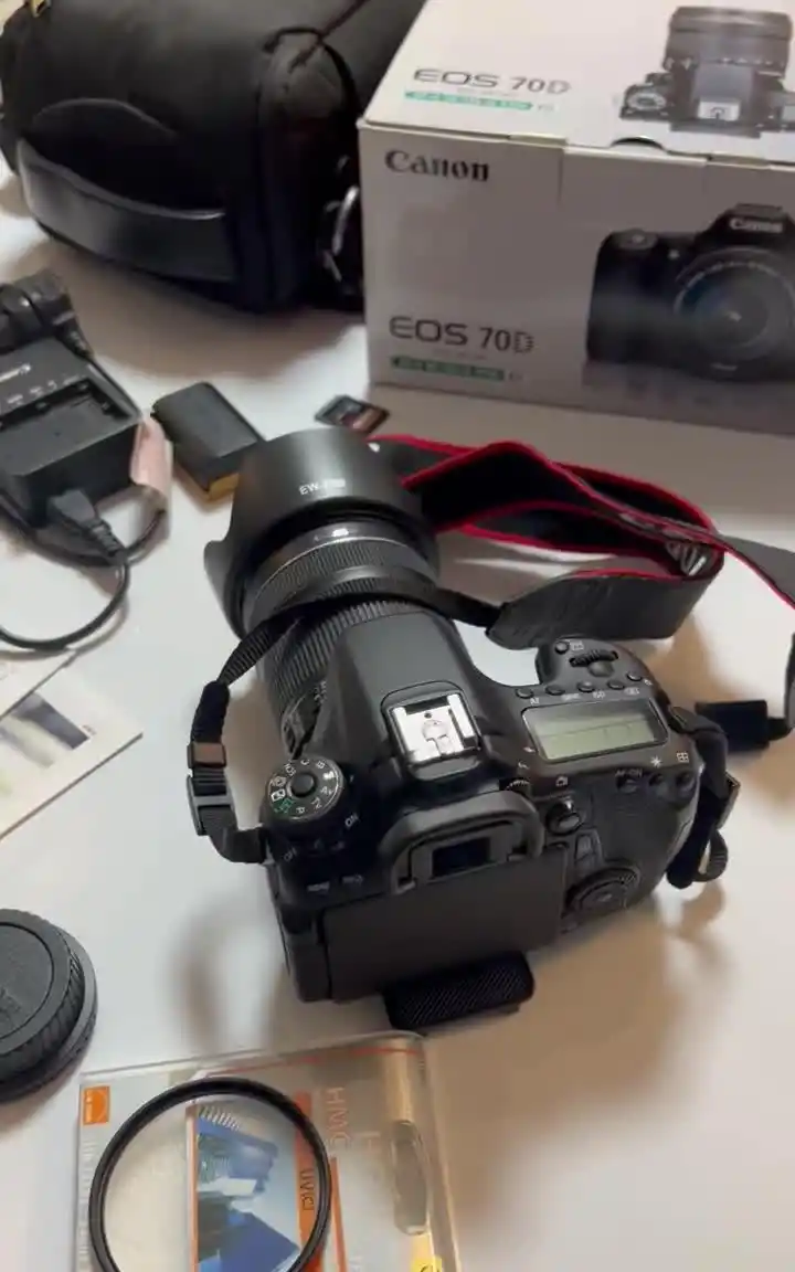دوربین کنون 70d ۷۰d لنز ۱۸-۱۳۵ تریپادسام نایس فوتو دست دو
