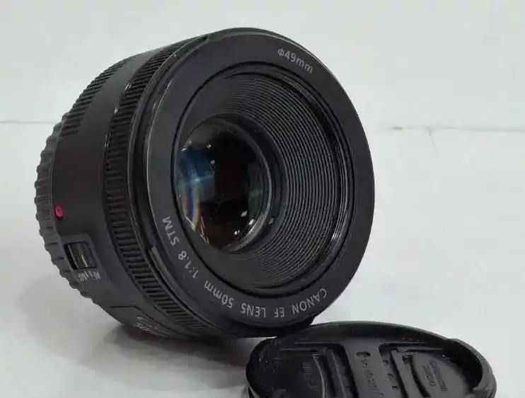 لنز دوربین کانن مدل EF 50mm f/1.8 STM دست دو