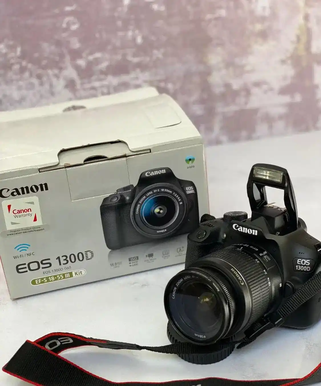 دوربین عکاسی دیجیتال کانن EOS 1300D دست دو