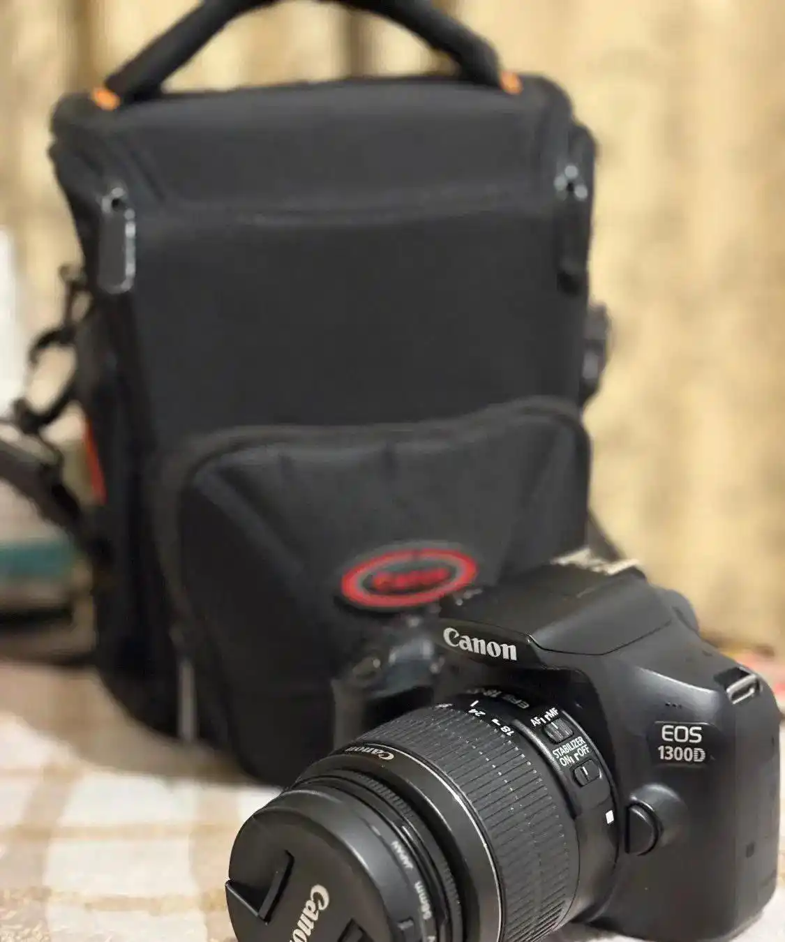 دوربین عکاسی کنون همراه با لنز canon eos 1300d دست دو