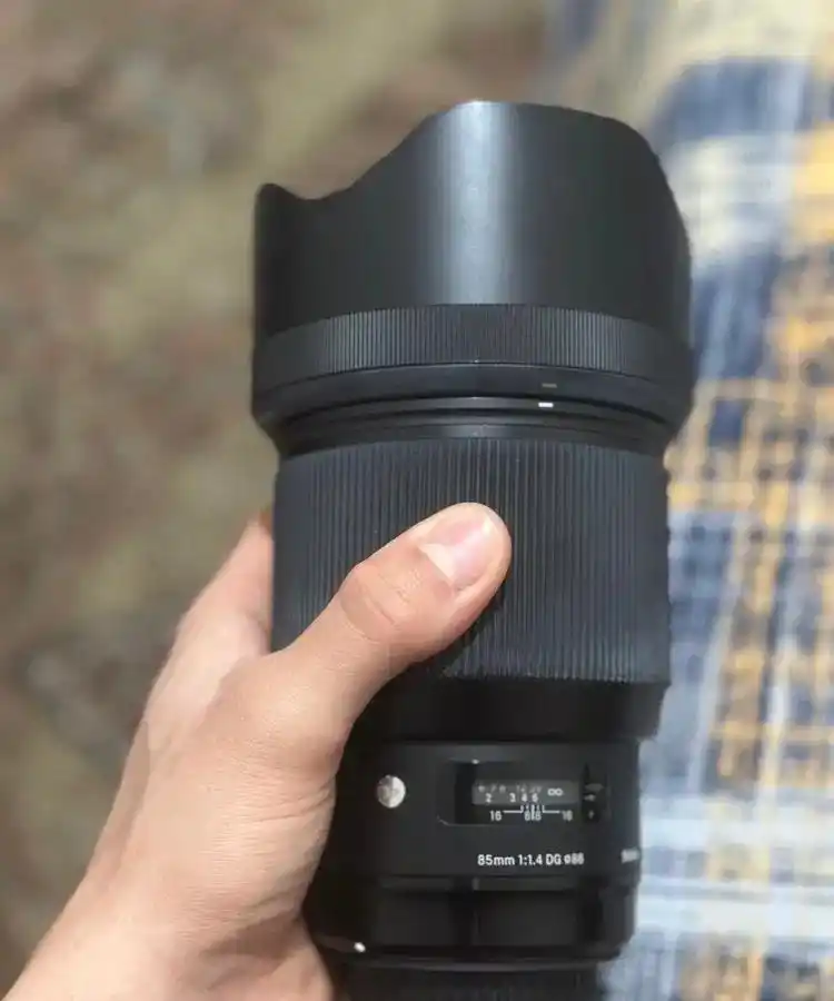 لنز 85mm sigma f1/4 art مانت کنون فروش فوریی دست دو