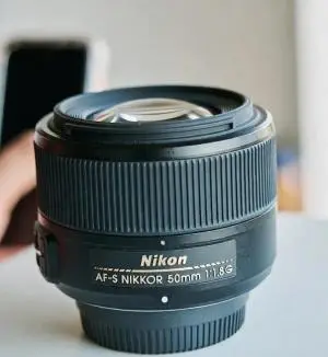 لنز نیکون 50mm f1.8 میلیمتر دست دوم