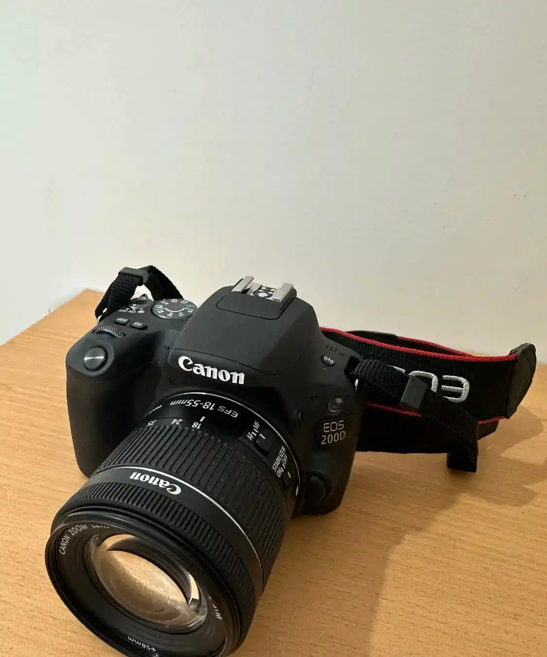 دوربین کنون EOS 200D + رم ۶۴ گیگ سن دیسک دست دو