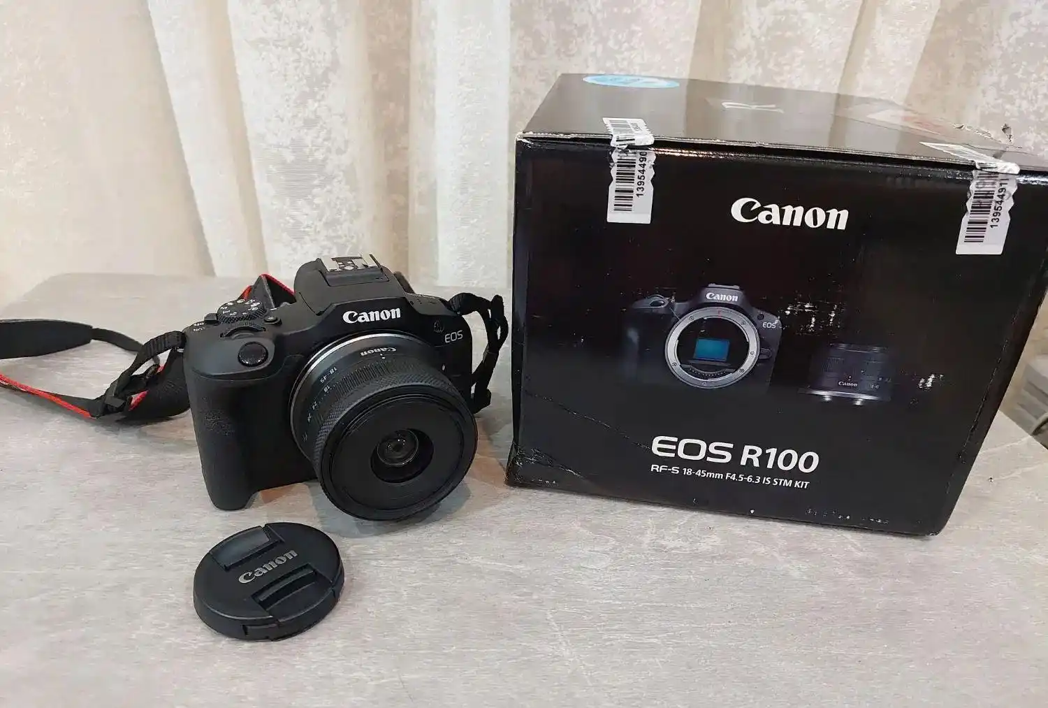 دوربین کنون R100 دست دو