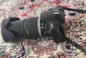 دوربین canon 1300D+کیف+سه پایه دست دوم